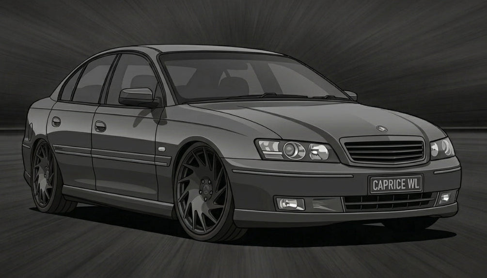 Black and white image of a car on a road with a dark background